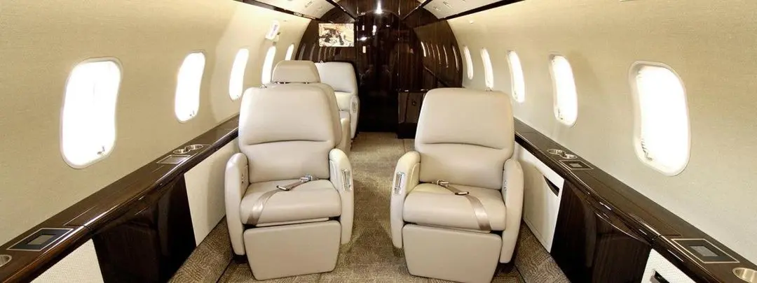 Luxurious leather seats in a private jet cabin.