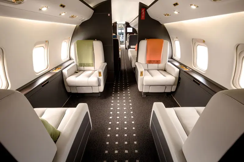 Luxurious private jet interior with spacious, comfortable seating.