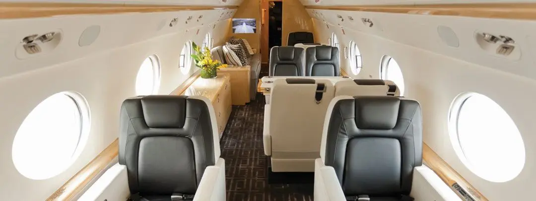 Luxurious private jet interior with plush seating and elegant decor.