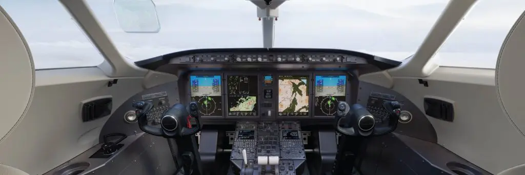 Cockpit view of a modern airplane showing flight instruments and controls.