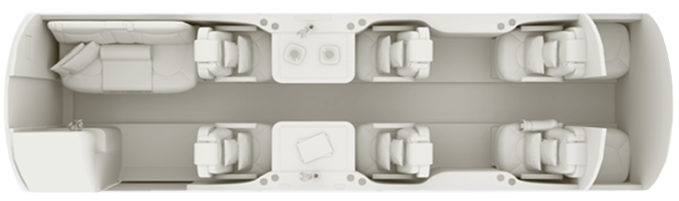 Overhead view of a modern office workspace with desks and chairs.