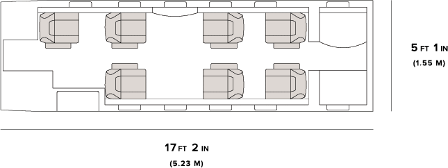 Top-down view of a seating layout with armchairs and a central table.