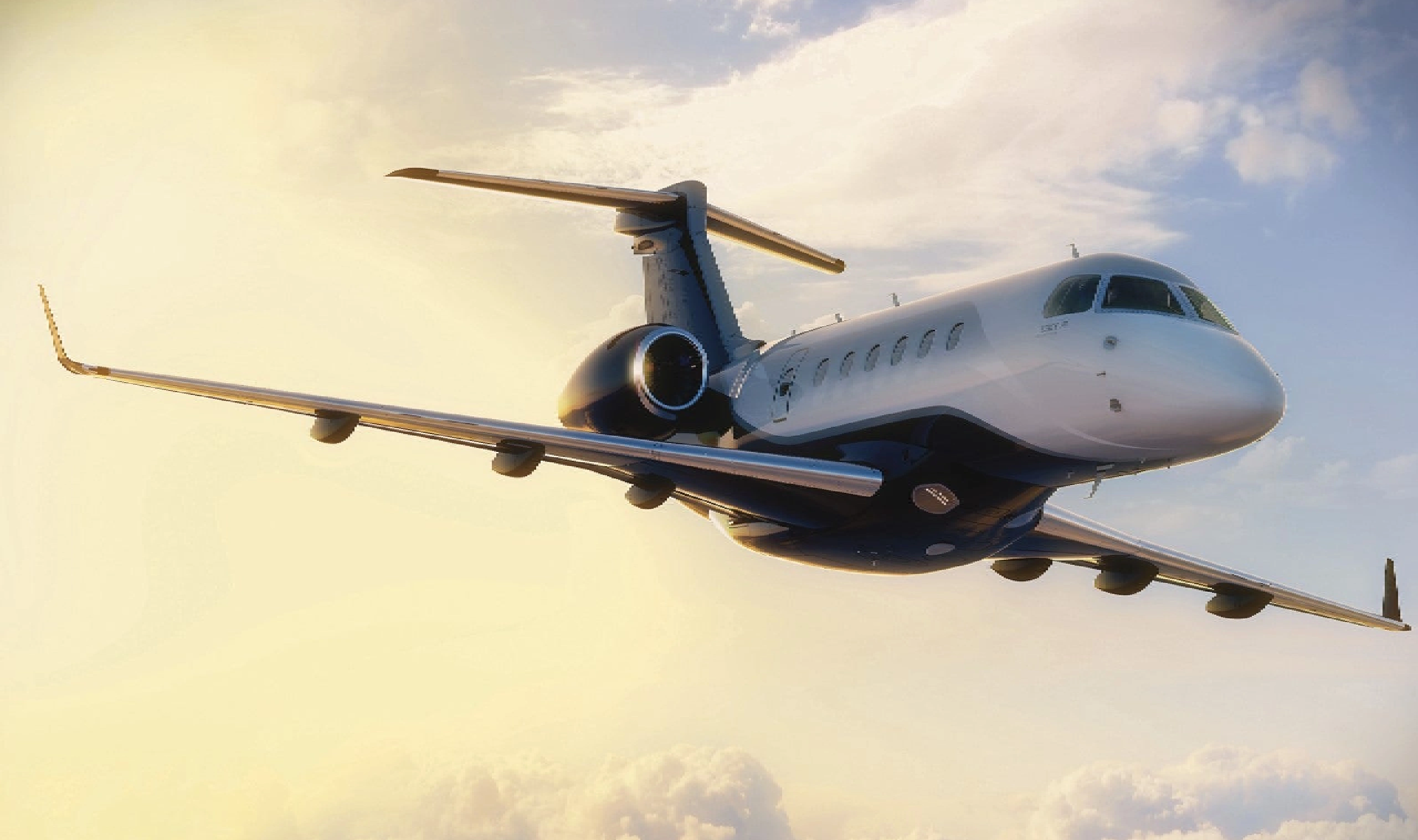 A private jet flying above clouds during sunset.