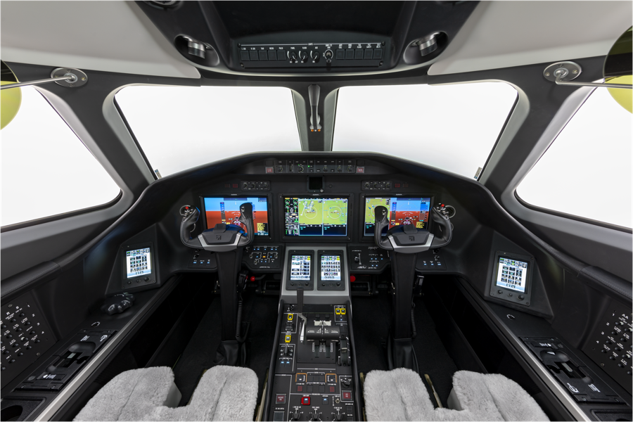 Modern aircraft cockpit with dual control panels and advanced navigation displays.