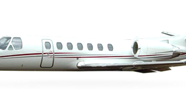 Side view of a private jet on the ground.