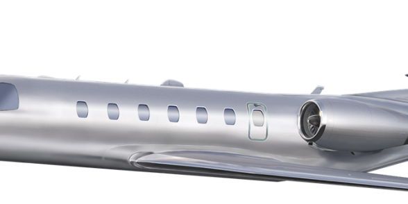 Silver private jet with sleek design and oval windows.