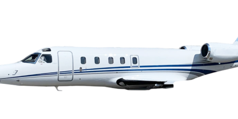 Close-up of a private jet's fuselage with windows and a blue stripe.